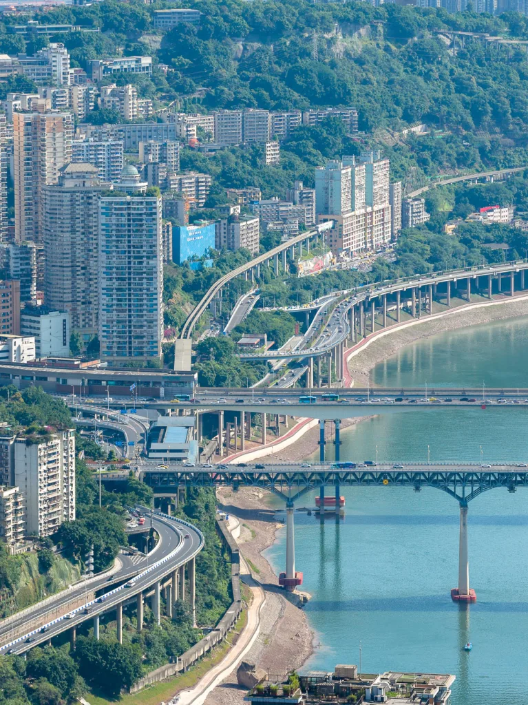 Bridges and hillside neighbourhoods lining a river valley in Chongqing