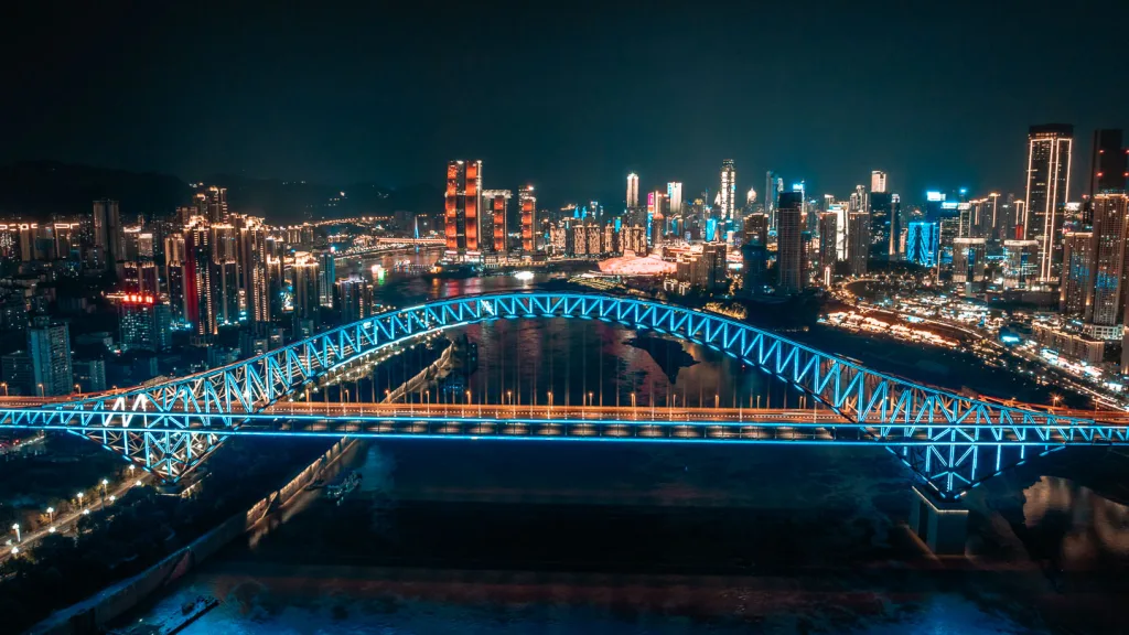 Aerial night view of Chaotianmen Bridge and Chongqing skyline