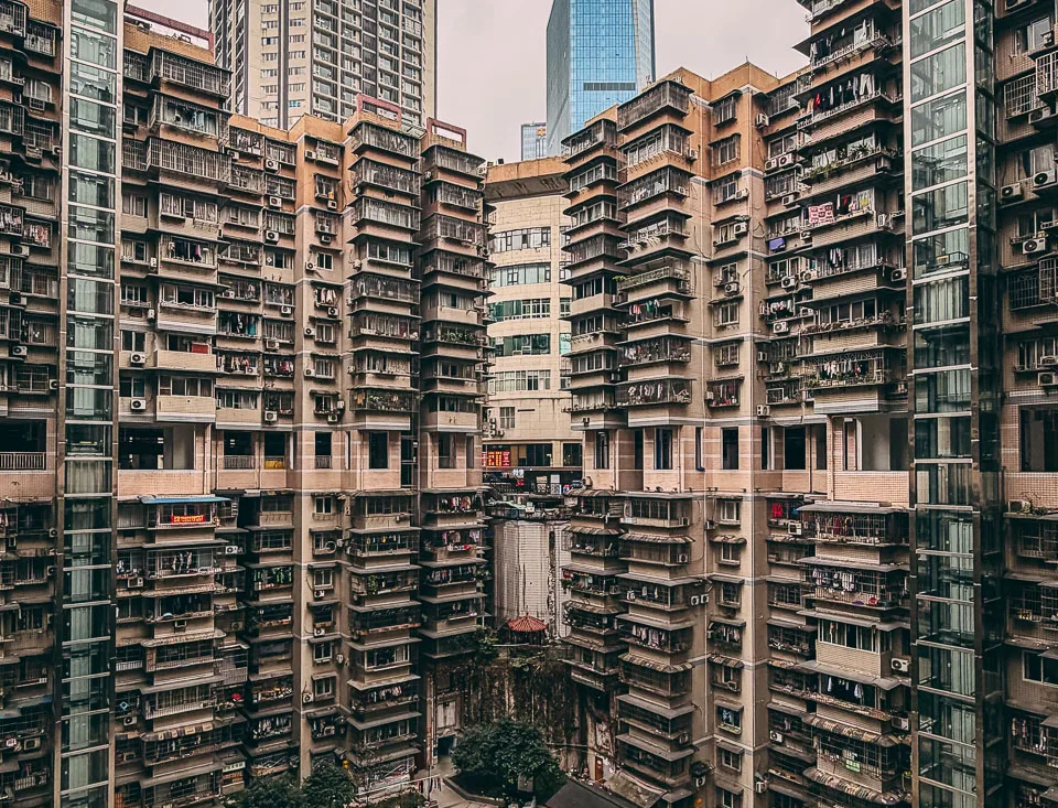 Dense high-rise apartments surrounding City Garden in Chongqing