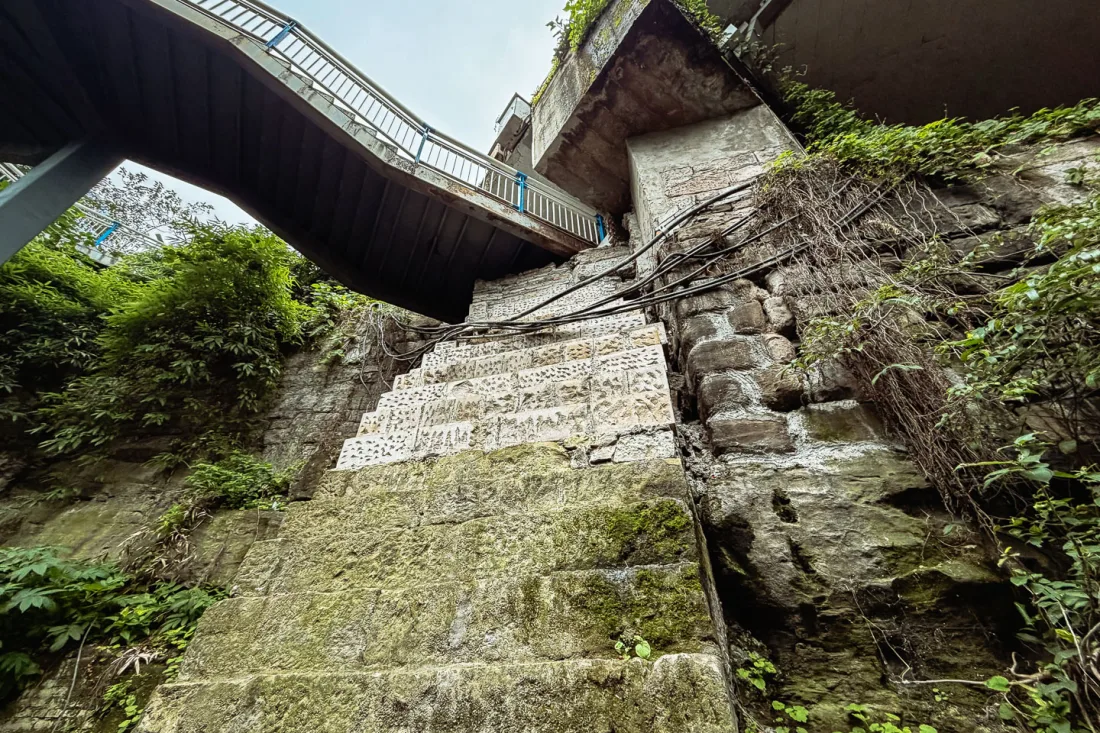 Steep stone steps and layered walkways in an old Chongqing neighbourhood