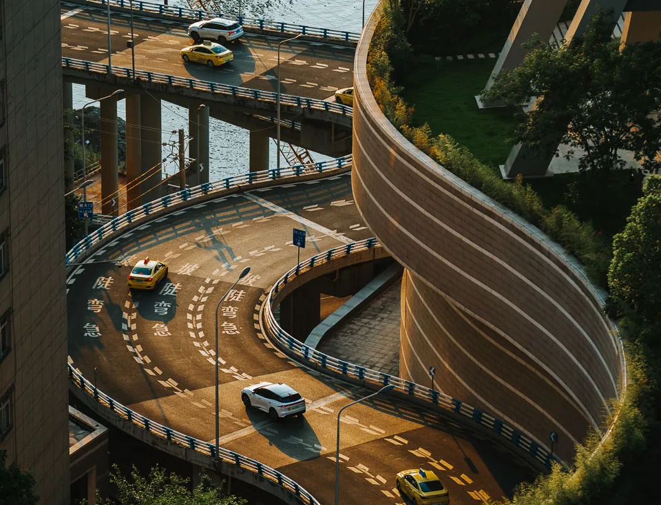 The curved elevated road winding beside Raffles City Chongqing