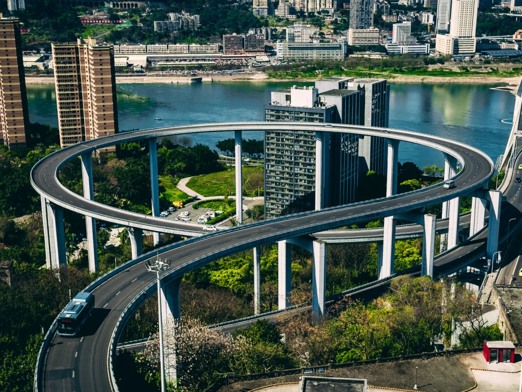 The circular Sujiaba interchange ramp rising above Chongqing