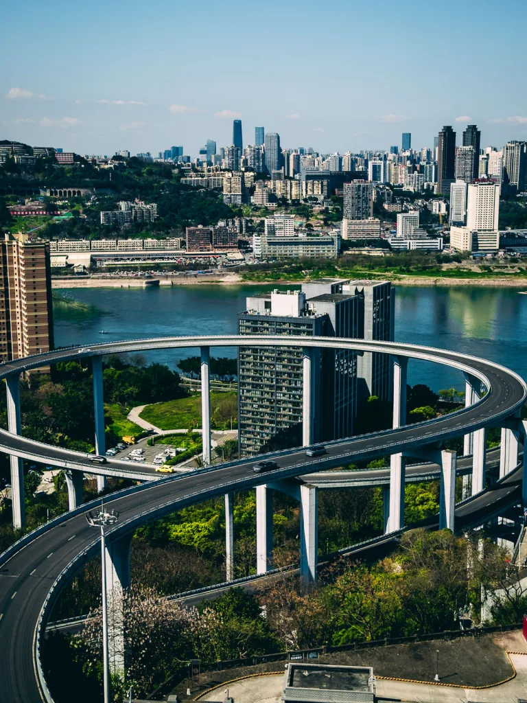 The circular Sujiaba interchange ramp rising above Chongqing