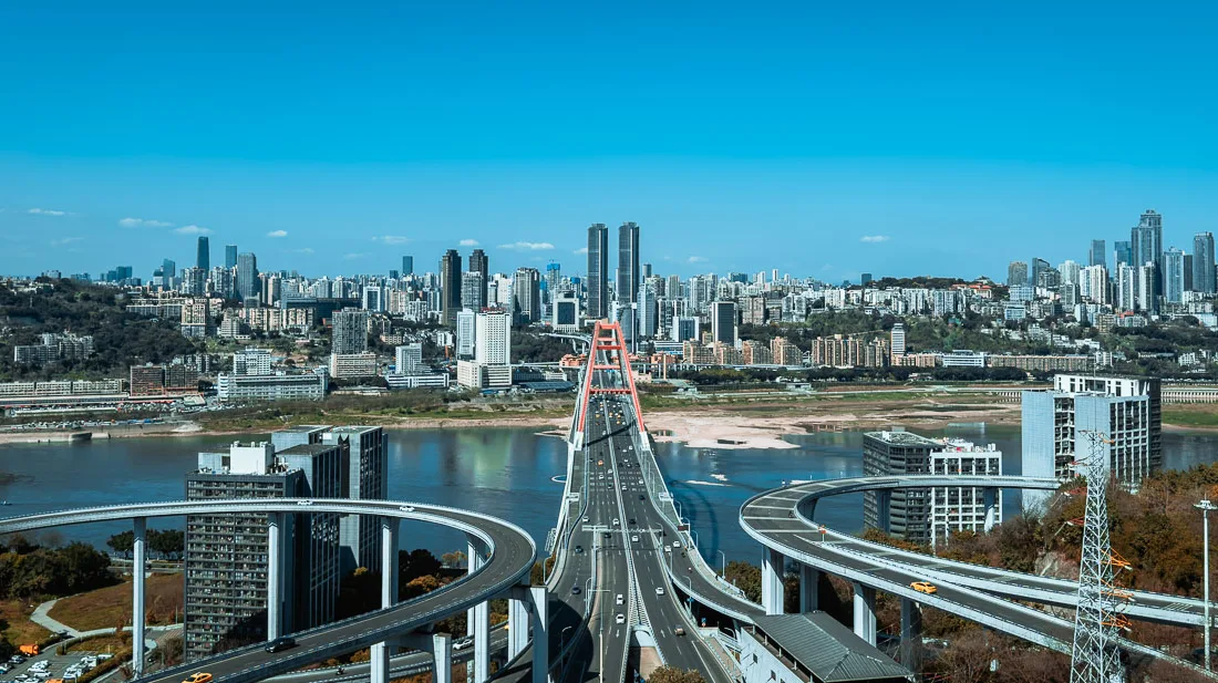 Visitors enjoying the elevated red walkway at Tongyuanzhiguang Sky Island