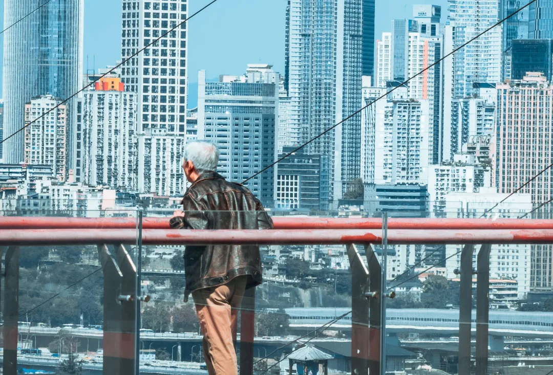 Visitors enjoying the elevated red walkway at Tongyuanzhiguang Sky Island