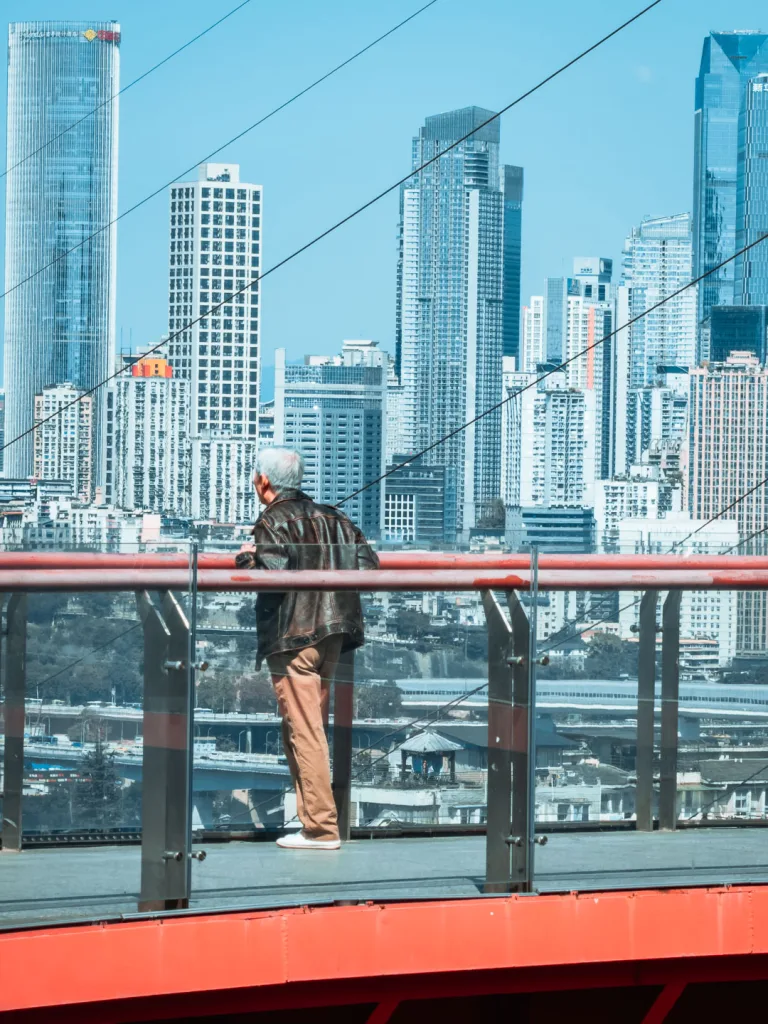 Visitors enjoying the elevated red walkway at Tongyuanzhiguang Sky Island