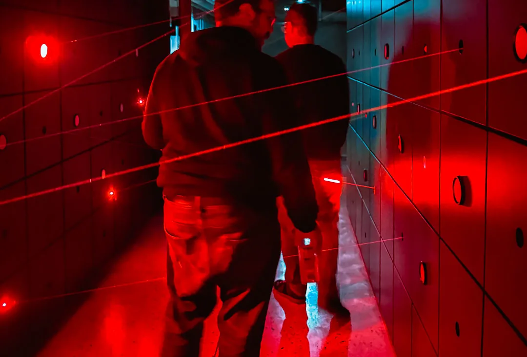 Visitors inside the red-lit bank vault at Chongqing Financial History Museum