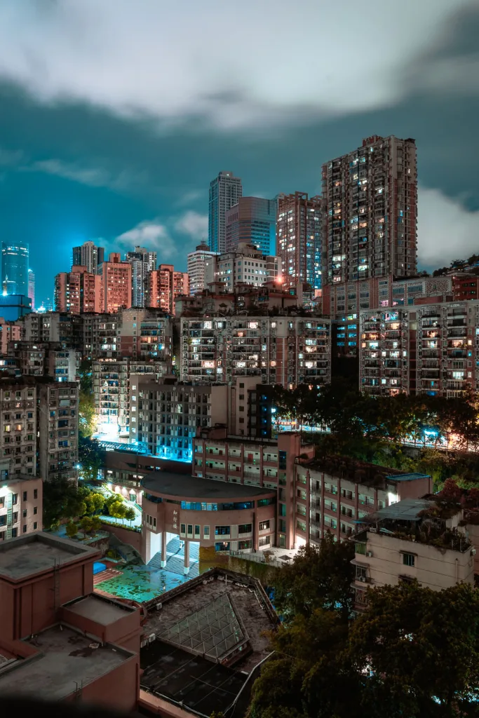 Layered outdoor walkways winding through a dense Chongqing residential building