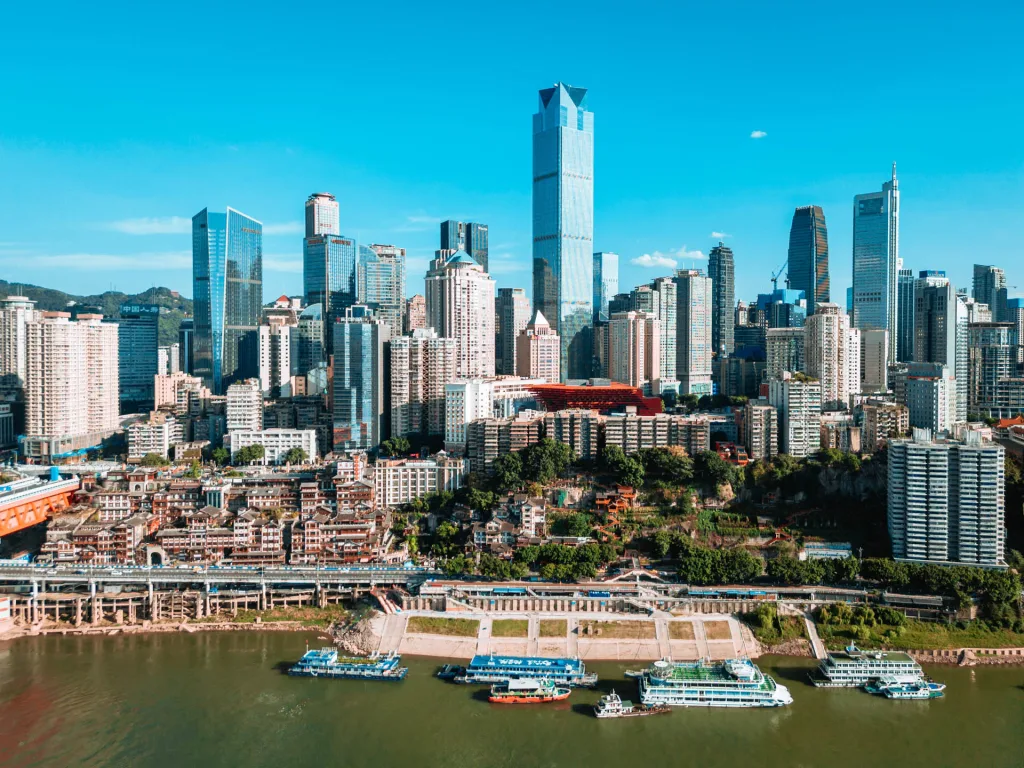 Chongqing skyscrapers rising above the riverfront in daylight