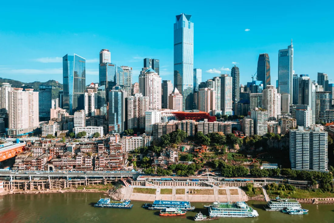 Chongqing skyscrapers rising above the riverfront in daylight