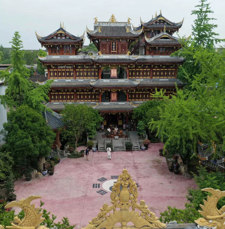 Traditional temple halls and courtyards surrounded by greenery in Chongqing