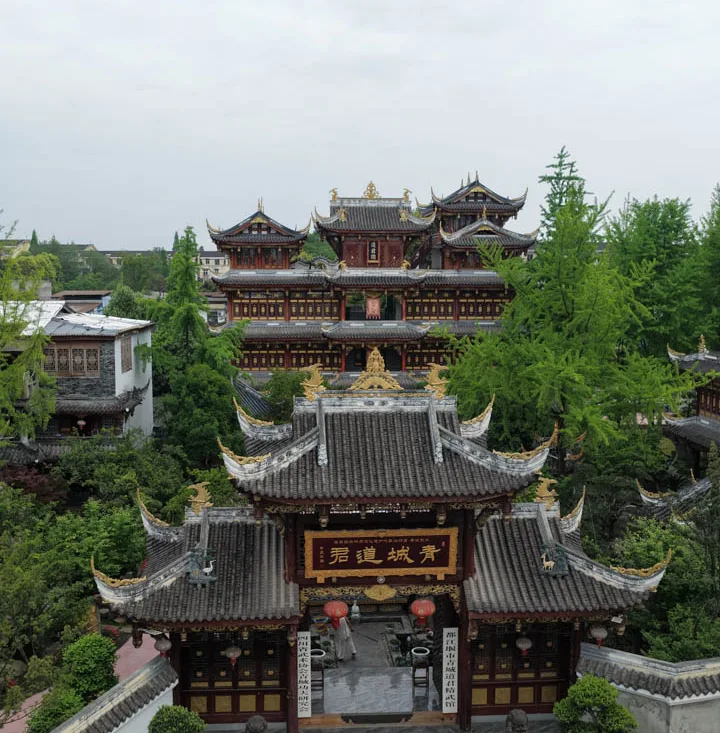 Traditional temple halls and courtyards surrounded by greenery in Chongqing