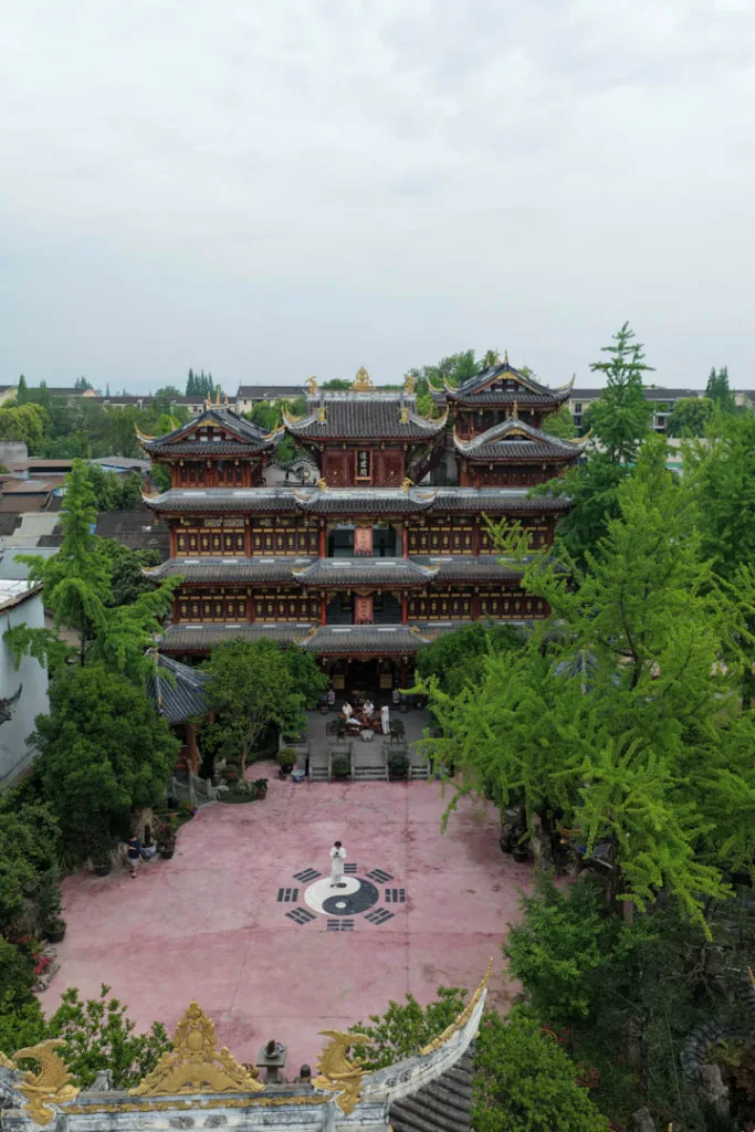 Traditional temple halls and courtyards surrounded by greenery in Chongqing