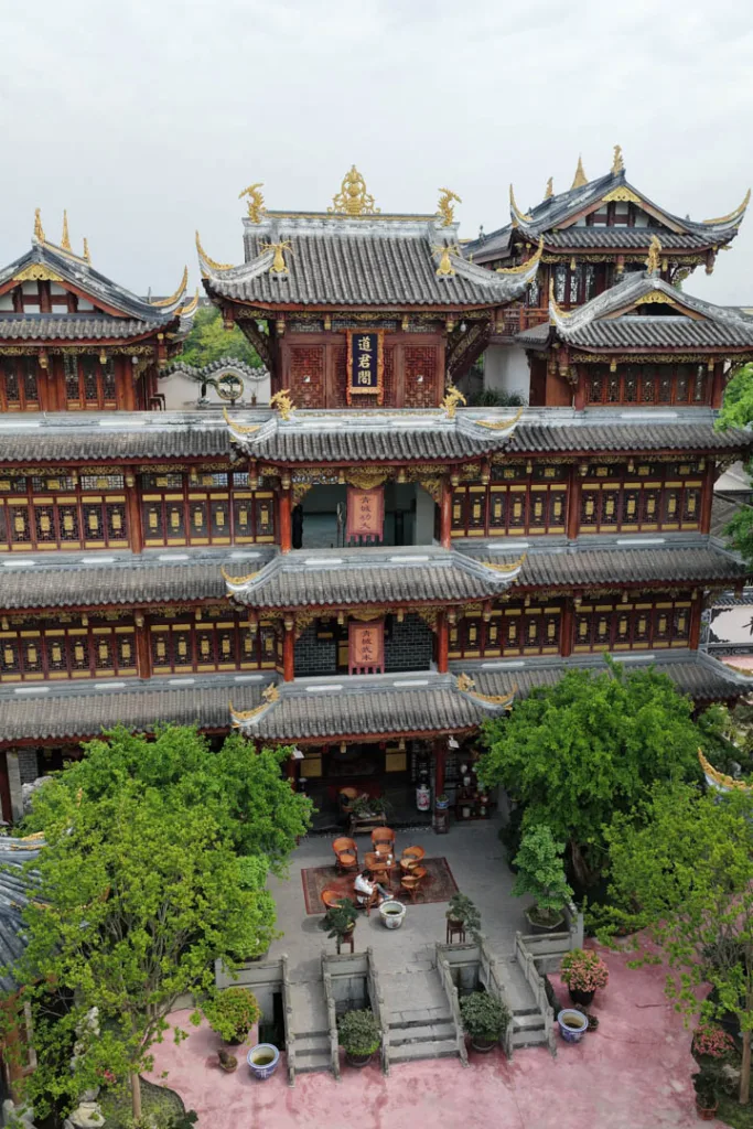 Traditional temple halls and courtyards surrounded by greenery in Chongqing