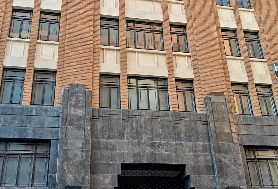 The stone façade of a historic financial building in Chongqing