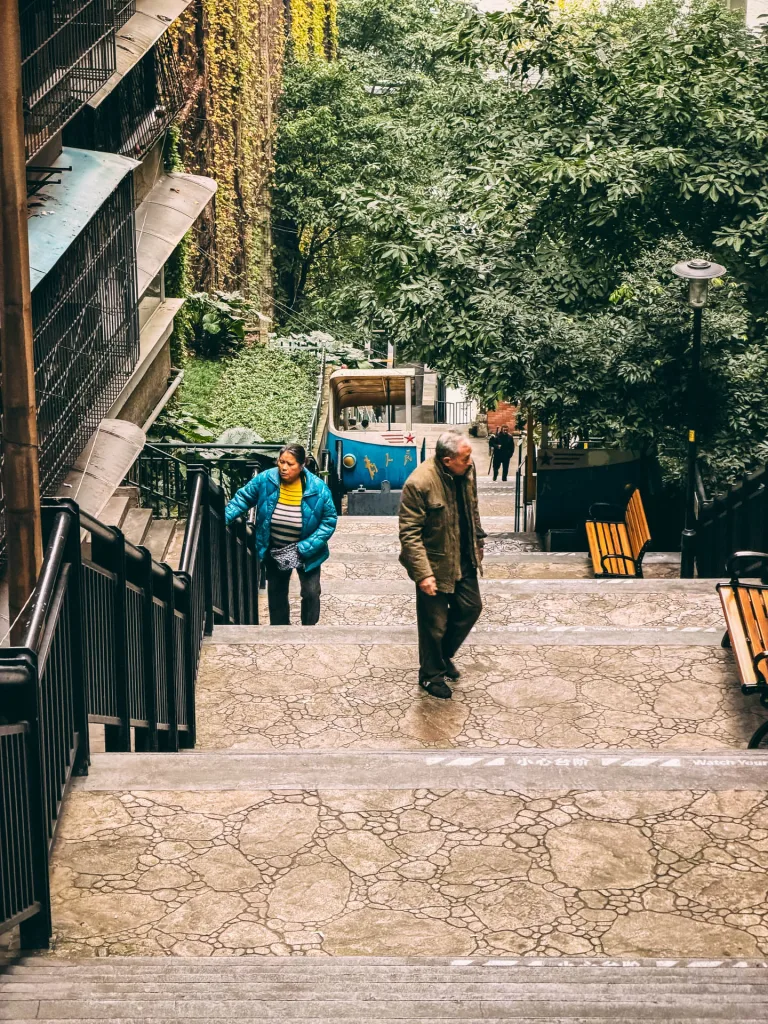 Steep stone steps climbing through an old hillside neighbourhood in Chongqing