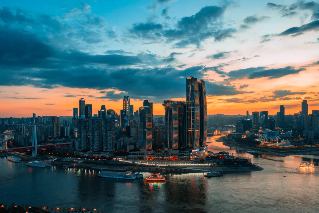 Chongqing skyline and riverfront illuminated by warm sunset light