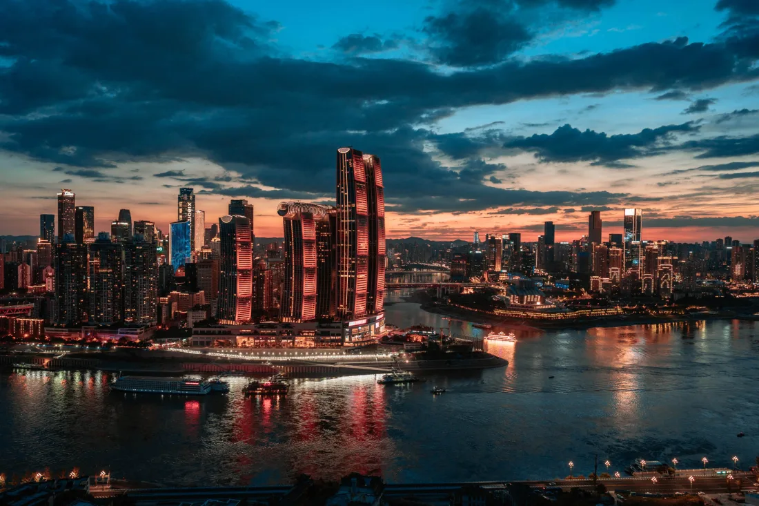 Chongqing skyline and riverfront illuminated by warm sunset light
