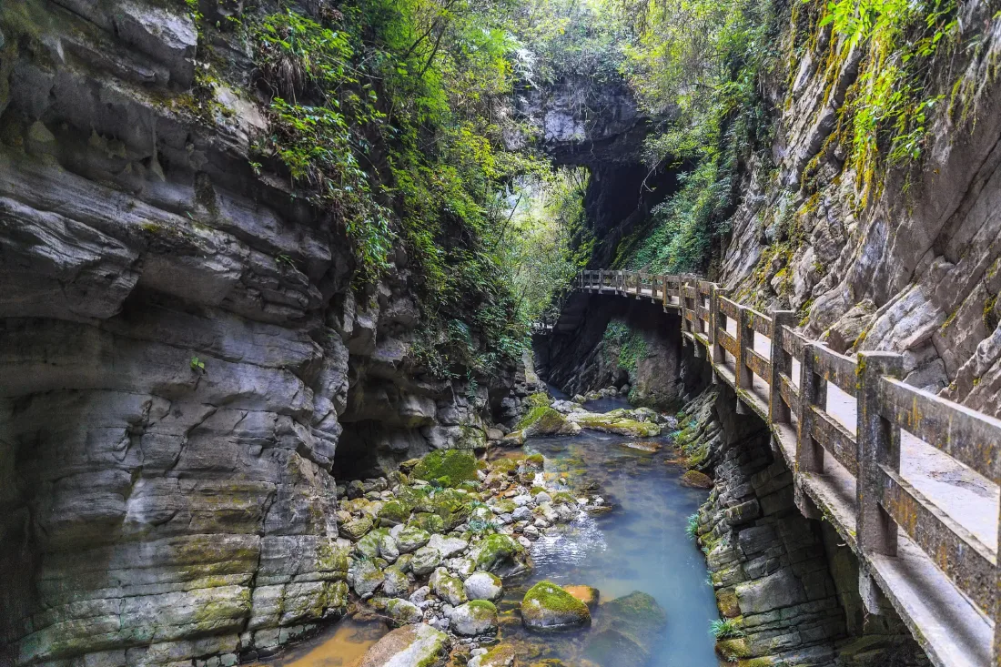 Waterfalls, cliffs and forest walkways inside Longshuixia Fissure Gorge in Wulong