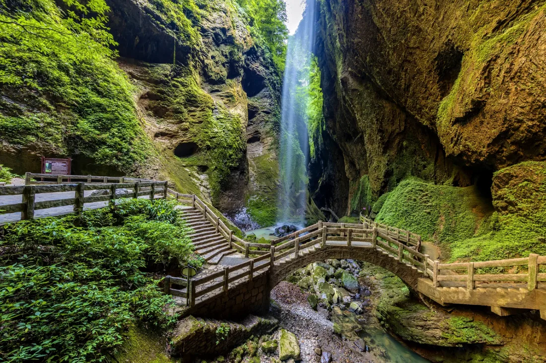 Waterfalls, cliffs and forest walkways inside Longshuixia Fissure Gorge in Wulong