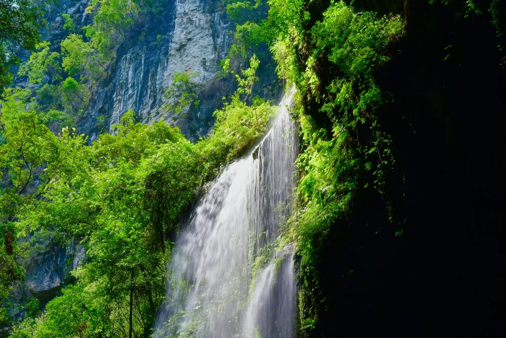 Waterfalls, cliffs and forest walkways inside Longshuixia Fissure Gorge in Wulong