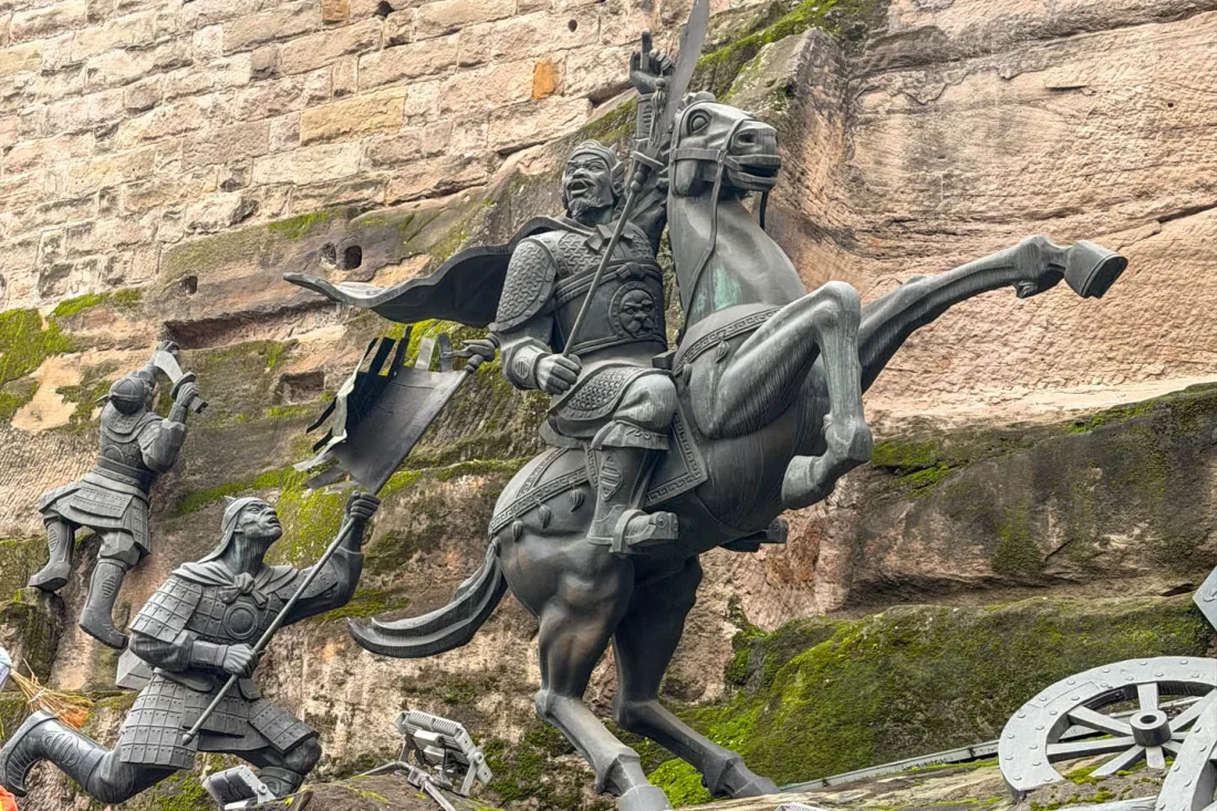 Historic stone walls, steps and sculptures at Tongyuan Gate in Chongqing