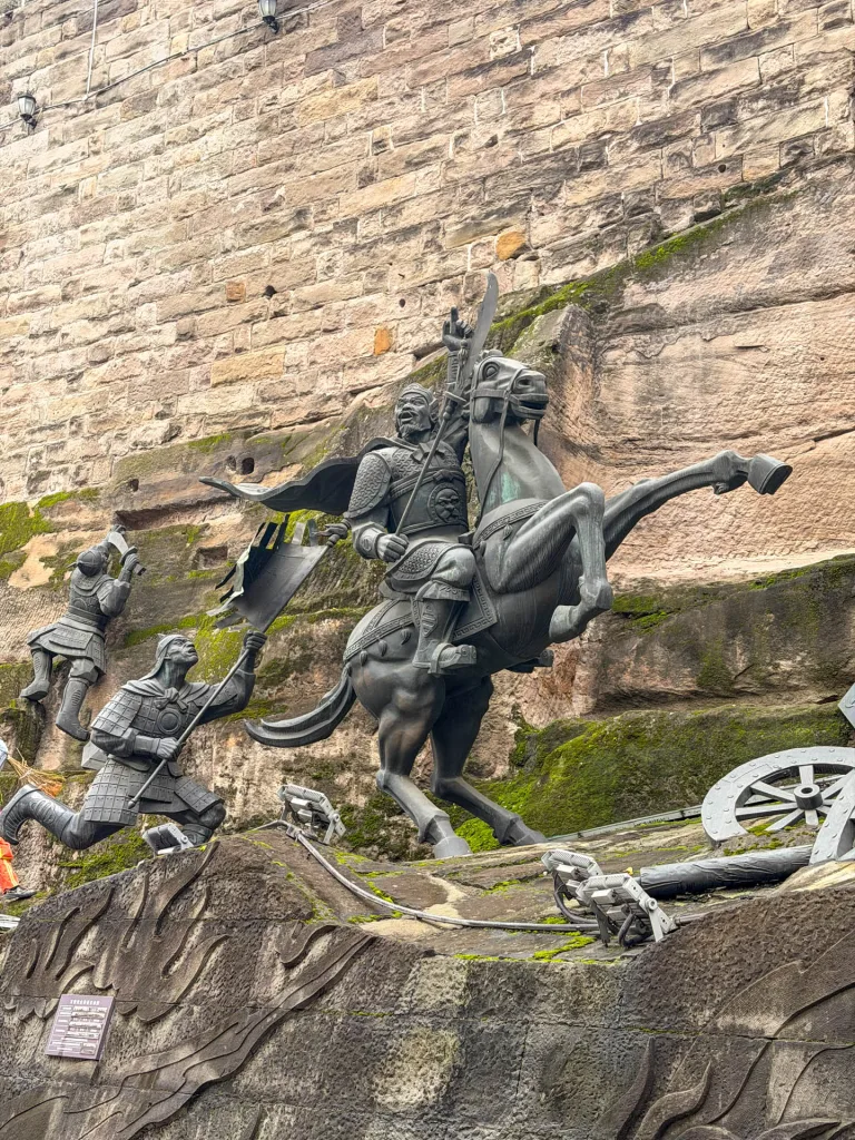 Historic stone walls, steps and sculptures at Tongyuan Gate in Chongqing