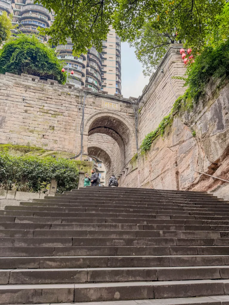 Historic stone walls, steps and sculptures at Tongyuan Gate in Chongqing