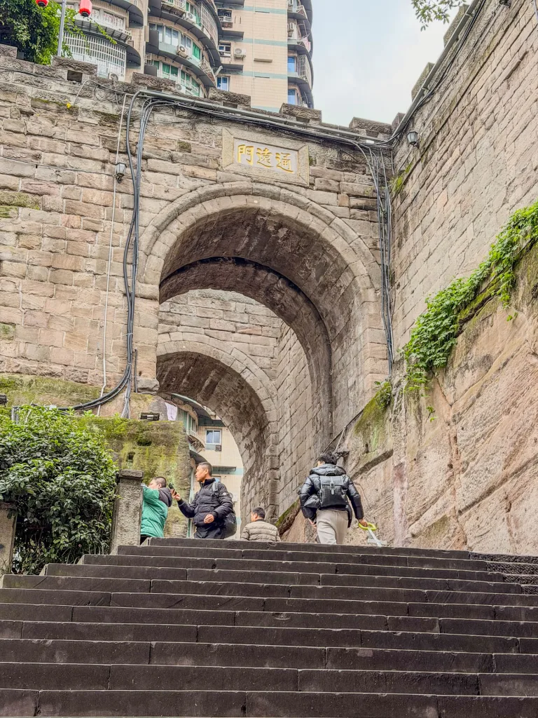 Historic stone walls, steps and sculptures at Tongyuan Gate in Chongqing