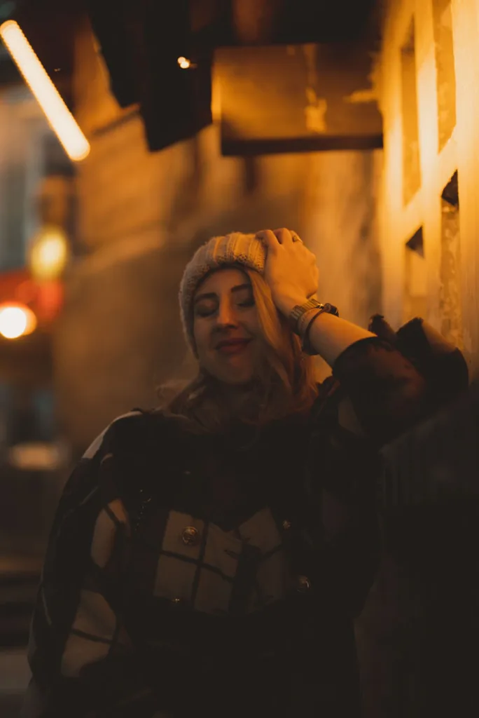 A traveller photographed beneath warm lights during a Chongqing night walk