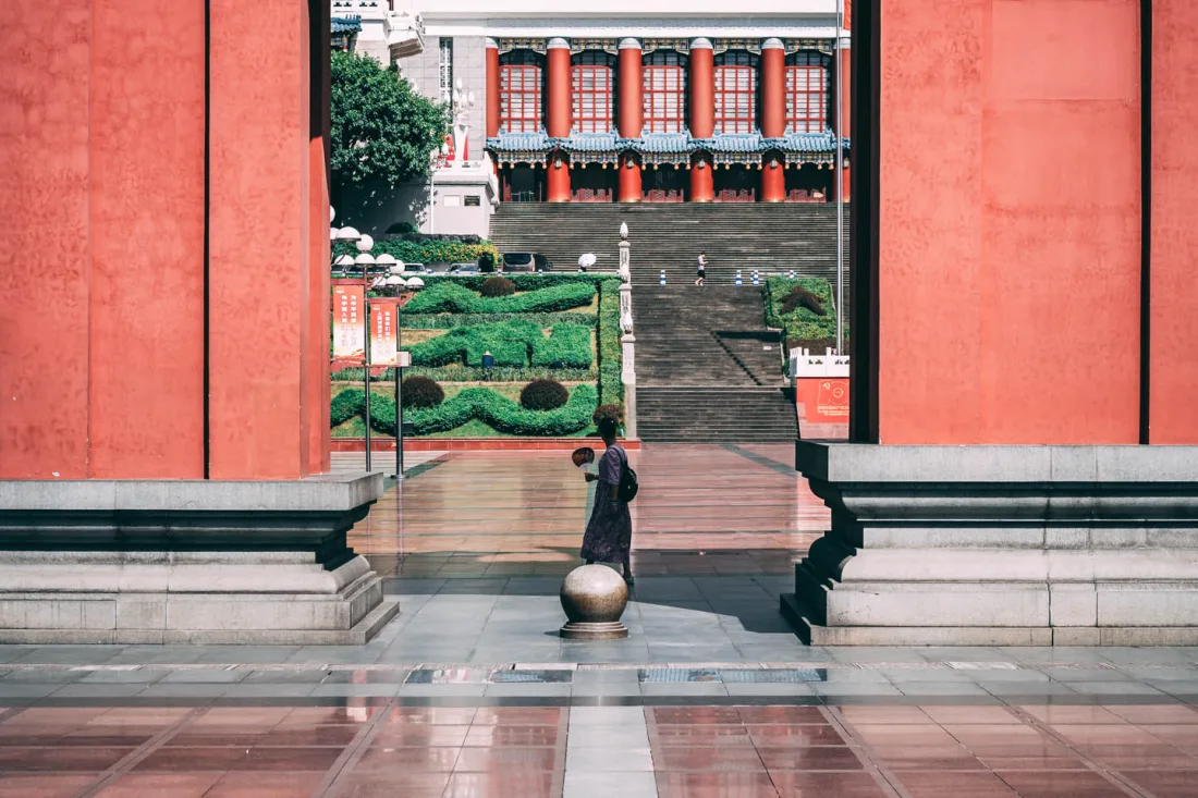 The Great Hall of the People in Chongqing beneath a bright blue sky