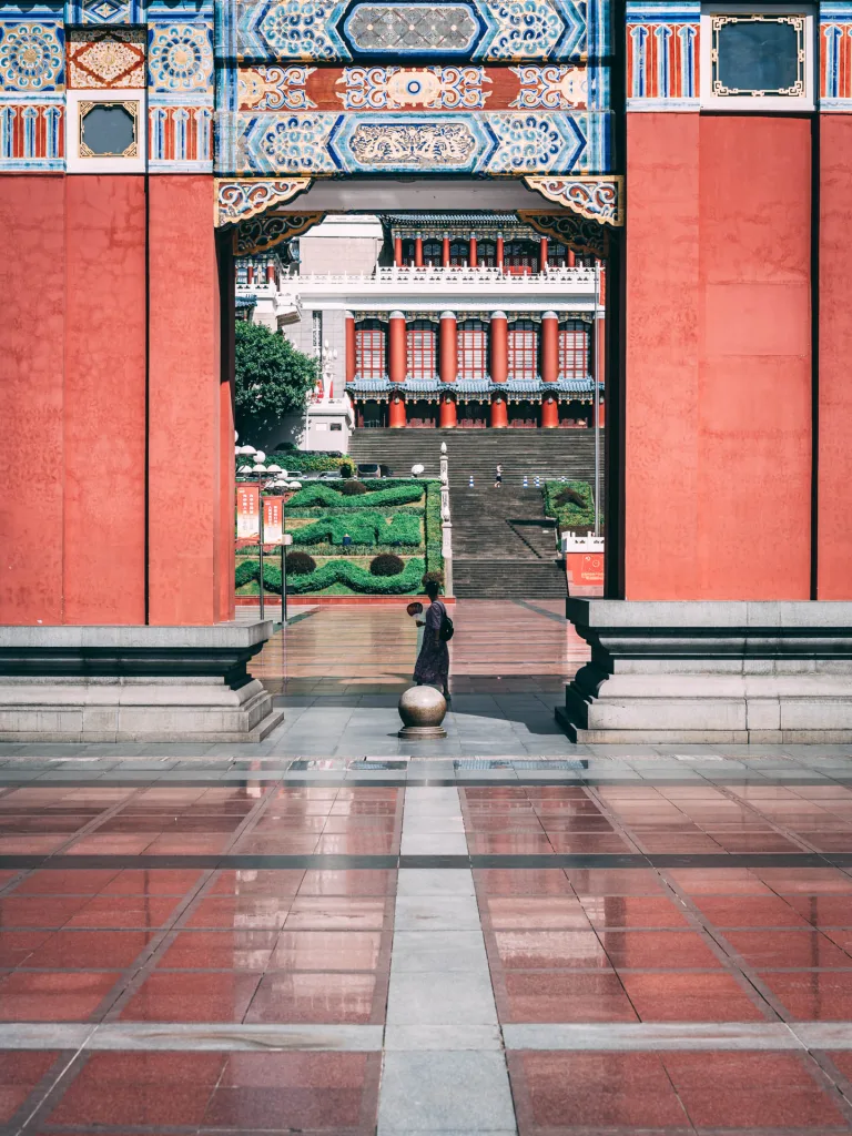 The Great Hall of the People in Chongqing beneath a bright blue sky