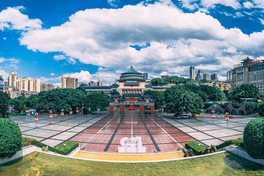 The Great Hall of the People in Chongqing beneath a bright blue sky
