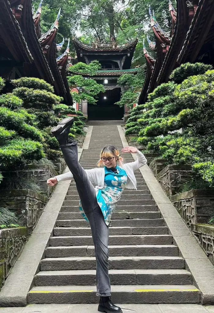 A guest learning a Tai Chi movement from a local master