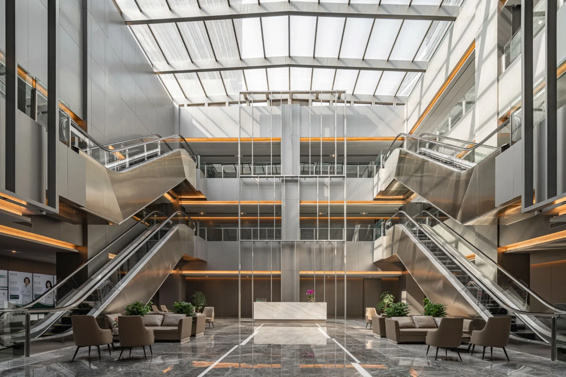 Sunlit atrium and reception inside Raffles Hospital Chongqing