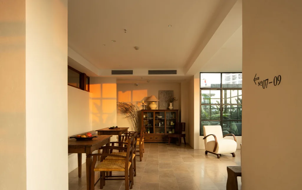 Sunlit shared living and tea space at SOMMET Rooftop Hotel